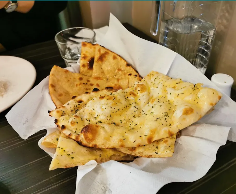 Freshly baked naan in a basket
